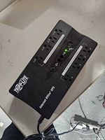 Top view of Tripp Lite Internet Office UPS showing eight outlets and LEDs.