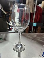 Single clear stemmed wine glass close-up