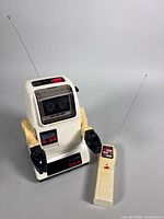 Front view of Tomy Chatbot robot with remote