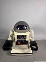 Front view of TOMY Omnibot 5402 showing dome head, antenna, arms and base