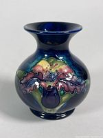 Front view of Moorcroft bud vase showing floral design