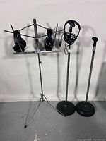 overall lot showing music stand with headphones and two mic stands