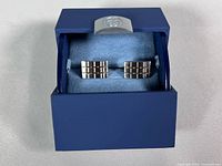 Pair of cufflinks in presentation box, lid open
