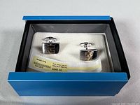 Cufflinks in presentation box with price tag visible