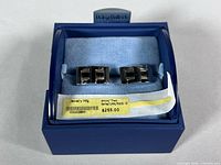 Cufflinks in original Dolan & Bullock box with price label visible