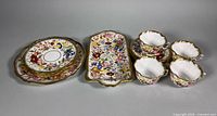full set of floral bone china pieces including tray, plates, cups