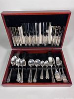 Open chest showing knives, forks and spoons in Dubarry pattern