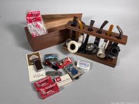 Full lot view showing pipes in stand, lighters, accessory boxes