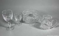 Group shot of all four cut crystal pieces: two Waterford goblets, Tyrone bowl, Galway tankard