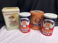 Group shot showing all four advertising canisters