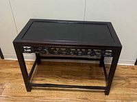 Front angled view showing full table, carved apron and stretcher