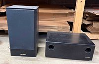 Subwoofer front with twin ports and satellite speaker front view