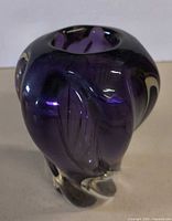 Front view showing purple color, clear base and sculptural form