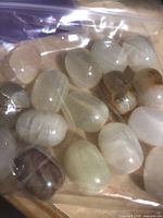 Bag of smooth translucent white polished oval stones