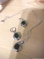 Emerald green pendant necklace and matching earrings
