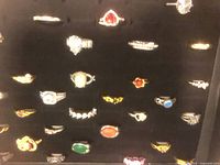 Front view of costume rings arranged in display tray