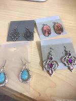 Eight pairs assorted metal and stone earrings on cards