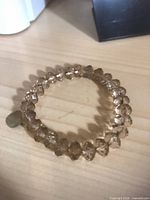 Champagne faceted bead stretch bracelet circular view
