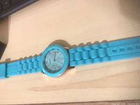 Turquoise silicone strap watch with round face