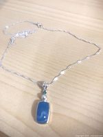 Silver-tone necklace with turquoise-look pendant