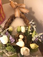 Oval Easter wreath with tulips, eggs, ribbon bow