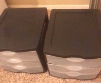 Two black-lid three-drawer plastic storage bins