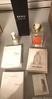 Overview of perfume bottles, REKU box and sample cards