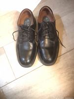 Black leather Florsheim dress shoes pair