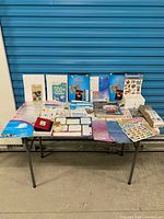 Overall view of all craft and scrapbooking items on table
