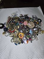 Pile of mixed costume jewellery on mat