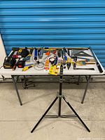 Overall view of table with full lot and tripod stand