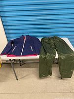 Full view of pants and jacket on table