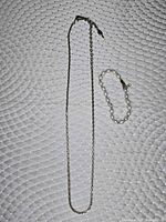 Full view of necklace and bracelet laid flat