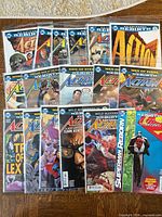 All 17 Action Comics issues laid out in overlapping rows