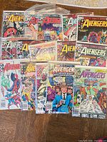 All 15 Avengers comic issues spread out