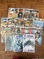 All 17 Detective Comics issues laid out in two rows, bagged and boarded