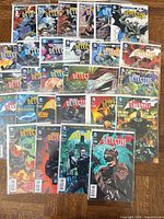 All 27 Detective Comics issues spread out