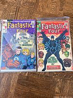 Front covers of Fantastic Four #45 and #46 in bags