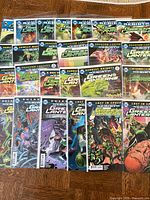 Front view of multiple Green Lanterns issues spread out