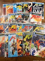 Multiple Flash Rebirth issues spread out showing cover art