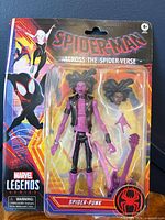 Front of sealed Spider-Punk action figure packaging showing contents