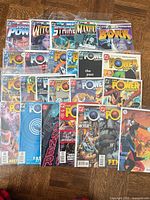 All 24 comics spread out showing covers