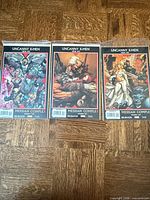 All three Uncanny X-Men issues 492-494 bagged and boarded on floor