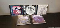 Group shot of all five Metallica CDs