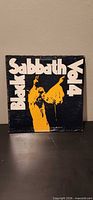 Front cover of Black Sabbath Vol 4 LP, showing title graphics and wear