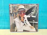 Front album cover showing title and artist