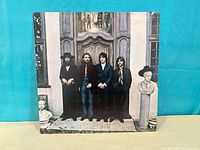 Front jacket with full group photo