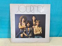 Front cover of Journey Next vinyl album showing title and band portrait