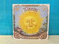 Front cover with illustrated sun and Klaatu title