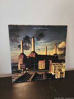 Front cover showing Battersea Power Station artwork with wear visible
